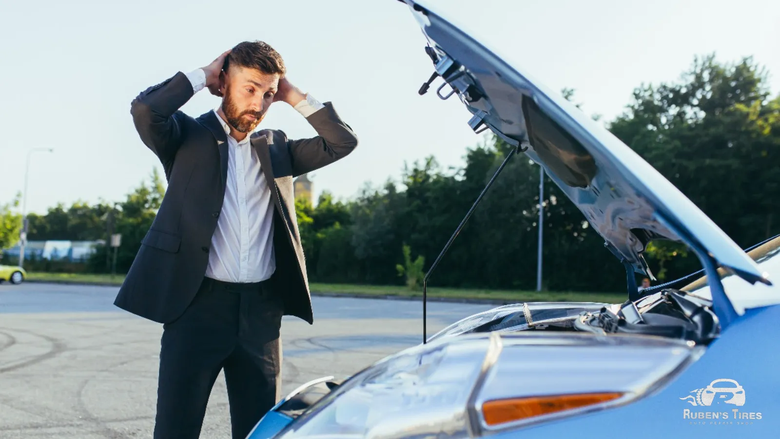 Driver experiencing car trouble with the hood open, seeking car maintenance services.