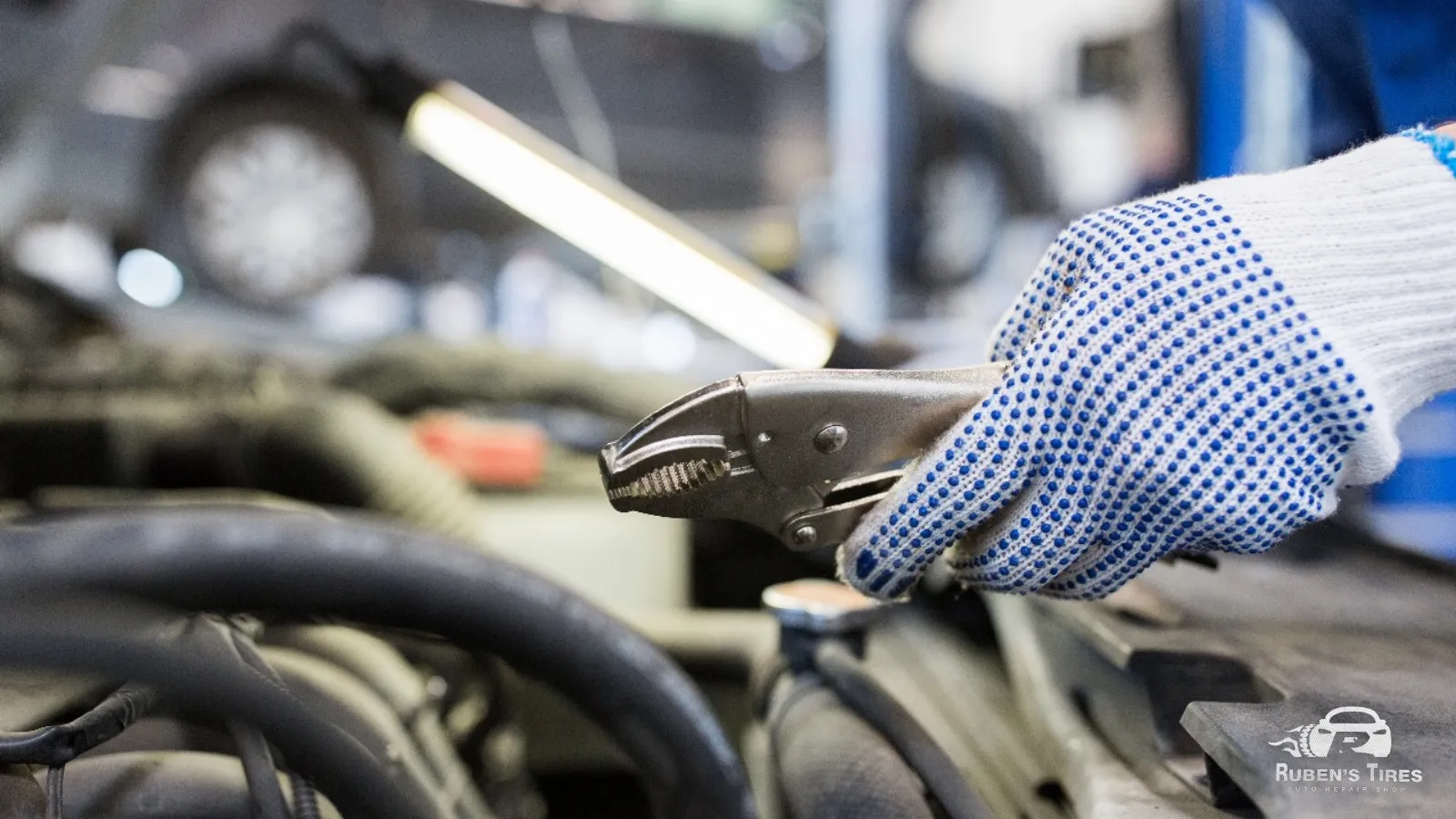 Mechanic using pliers during smart auto maintenance at Ruben’s Tires