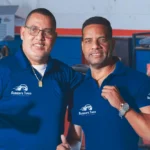 Happy and motivated corporate team celebrating success, representing a positive and collaborative environment at Ruben's Auto Body Shop Central Florida.