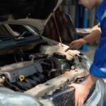 Professional technician inspecting engine components during Suspension & Steering Repair Central Florida, ensuring vehicle safety and performance.